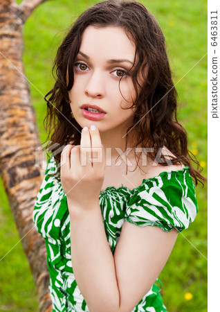 Woman enjjoying rain at summer park she is free and vulnerable Woman enjjoying rain at summer park she is free and vulnerable 6463811