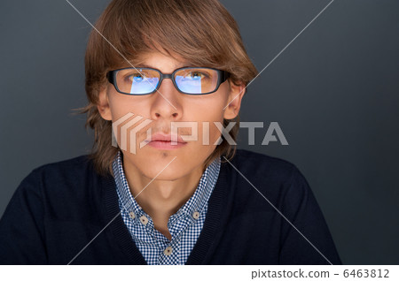 Portrait of young man with smart and wise look. Looking at camer Portrait of young man with smart and wise look. Looking at camer 6463812