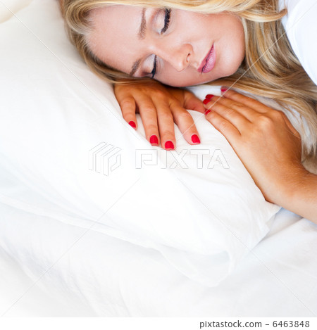 Portrait of young beautiful sleeping woman on bed at bedroom Portrait of young beautiful sleeping woman on bed at bedroom 6463848