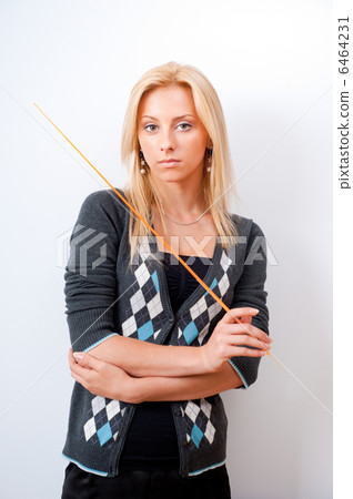 Portrait of young teacher pointing on white marker board in mode Portrait of young teacher pointing on white marker board in mode 6464231