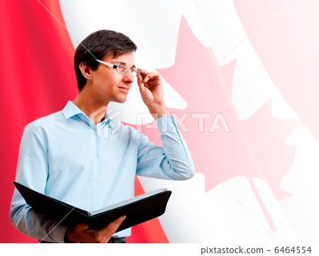 Portrait of adult man wearing formal clothes and glasses holding 6464554