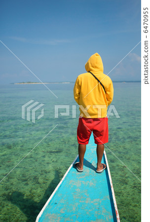 Philippino man on a nose of bangka boat Philippino man on a nose of bangka boat 6470955