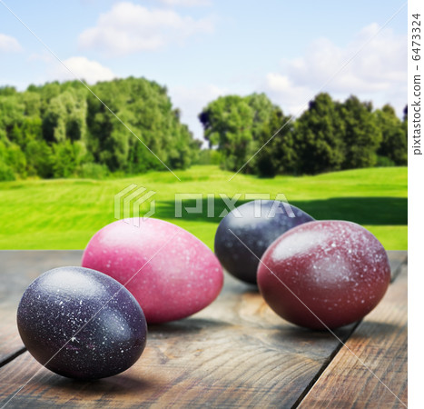 colored Easter eggs on a wooden table colored Easter eggs on a wooden table 6473324