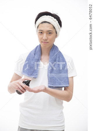 A young man who performs a face care A young man who performs a face care 6478052