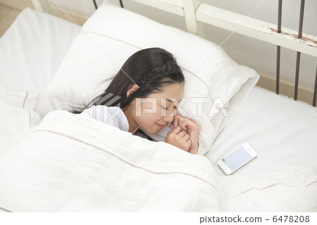 A young lady sleeping on bed A young lady sleeping on bed 6478208