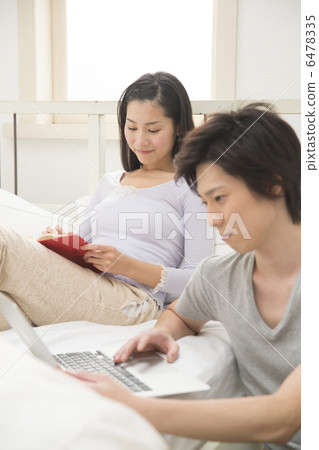 Young couple relaxing at bed Young couple relaxing at bed 6478335