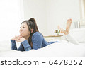 A young woman relaxing at bed 6478352