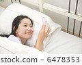 A young woman relaxing at bed 6478353