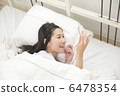 A young woman relaxing at bed 6478354