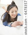 A young woman relaxing at bed 6478357
