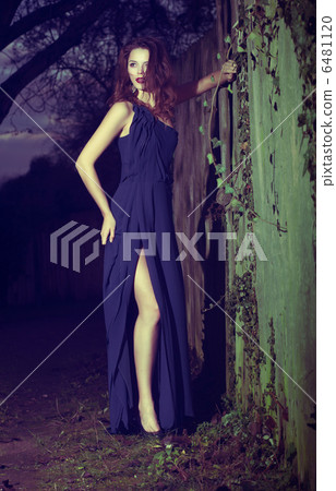Fashion Model in Modern Blue Dress posing Outdoors 6481120