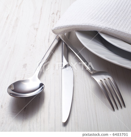fork, knife, spoon and a white plate 6483701