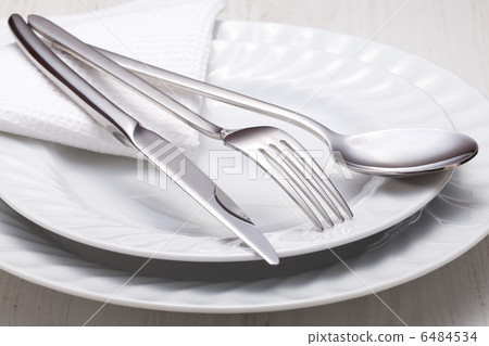 fork, knife, spoon and a white plate fork, knife, spoon and a white plate 6484534