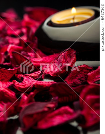 spa background. red petals, stones black and candle 6487568