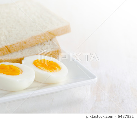 Boiled egg and toasts on white plate Boiled egg and toasts on white plate 6487821