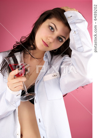 Cute young female with glass of red wine Cute young female with glass of red wine 6489202