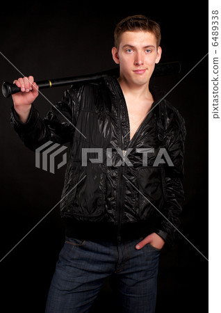 Young man with baseball-bat 6489338