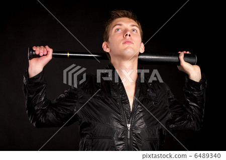 Young man with baseball-bat 6489340