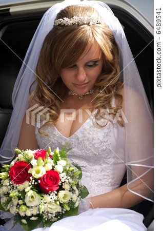 Portrait of the bride sitting in the car Portrait of the bride sitting in the car 6489541