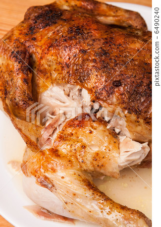 roast chicken on white plate and wooden roast chicken on white plate and wooden 6490240