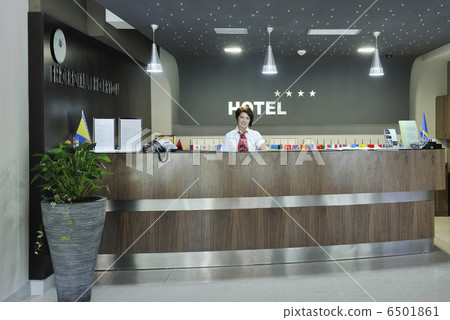 smiling businesswoman at the reception desk smiling businesswoman at the reception desk 6501861