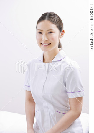 A woman in a white coat A woman in a white coat 6508123