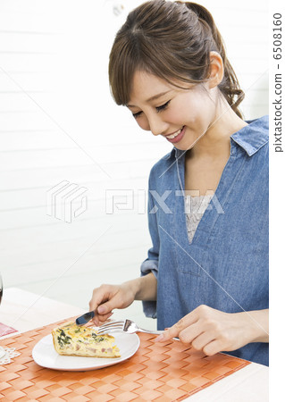 A woman who is cooking A woman who is cooking 6508160