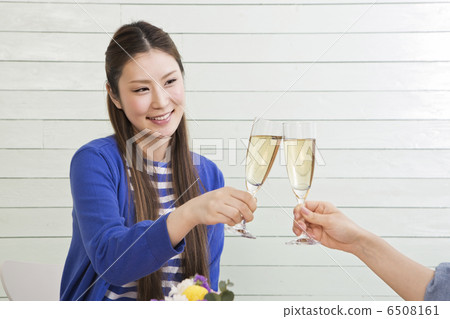 A woman toasting with champagne 6508161
