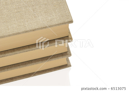 Three stacked books 6513075
