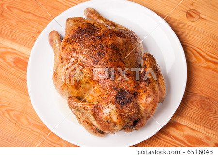roast chicken on white plate and wooden roast chicken on white plate and wooden 6516043