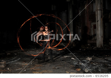 Woman holds in his hand the fire Woman holds in his hand the fire 6516205