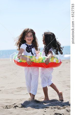 happy child group playing on beach happy child group playing on beach 6527783
