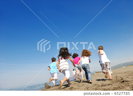 happy child group playing on beach happy child group playing on beach 6527785
