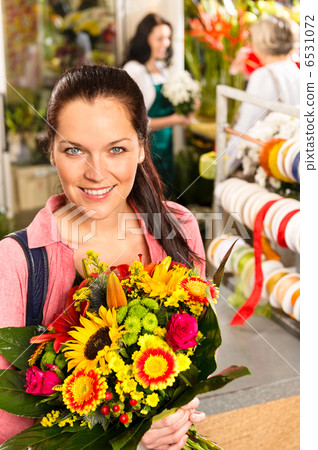 Smiling young florist woman colorful bouquet shop Smiling young florist woman colorful bouquet shop 6531072