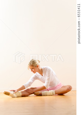 Ballet dancer in leaning posture exercise studio 6531411