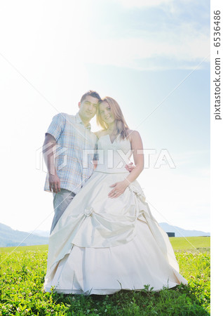 beautiful bride outdoor with colorful windmill toy beautiful bride outdoor with colorful windmill toy 6536486
