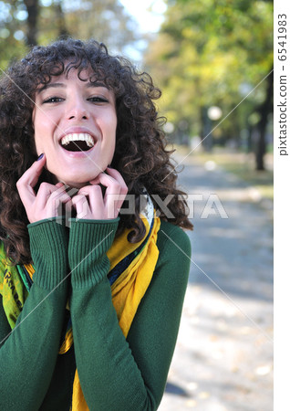 brunette Cute young woman smiling brunette Cute young woman smiling 6541983
