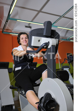 Young woman working out in gym Young woman working out in gym 6541984