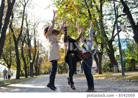 Three young ladies enjoying themselves 6542009