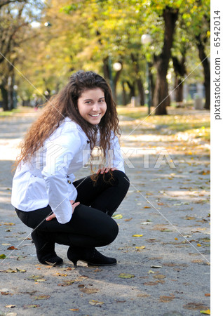 brunette Cute young woman smiling outdoors in nature brunette Cute young woman smiling outdoors in nature 6542014