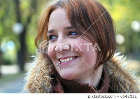 brunette Cute young woman smiling outdoors brunette Cute young woman smiling outdoors 6542031