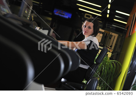 Young woman working out in gym Young woman working out in gym 6542093