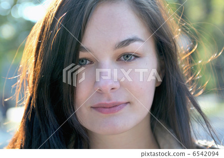 Cute young woman smiling Cute young woman smiling 6542094