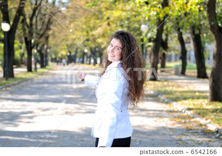 brunette Cute young woman smiling outdoors in nature brunette Cute young woman smiling outdoors in nature 6542166