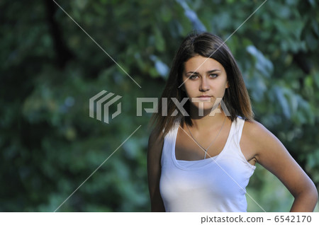brunette Cute young woman smiling outdoors in nature brunette Cute young woman smiling outdoors in nature 6542170