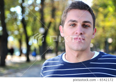 happy young casual man outdoor portrait posing happy young casual man outdoor portrait posing 6542172