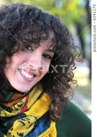 brunette Cute young woman smiling brunette Cute young woman smiling 6542179