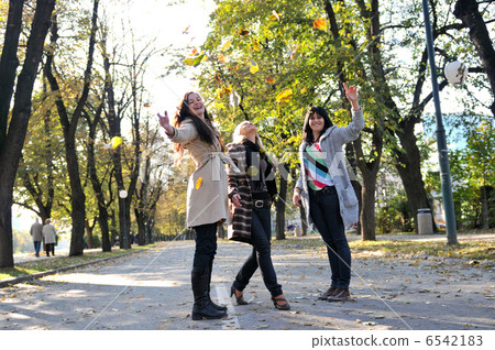 Three young ladies enjoying themselves Three young ladies enjoying themselves 6542183