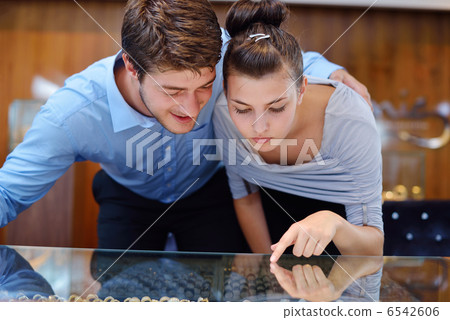 happy young couple in jewelry store happy young couple in jewelry store 6542606