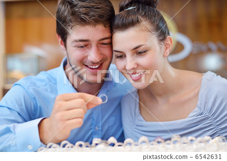 happy young couple in jewelry store happy young couple in jewelry store 6542631